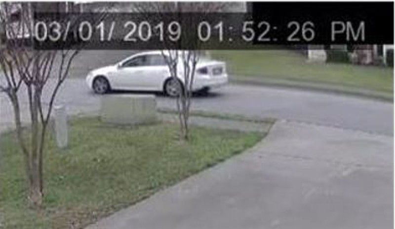 A neighbor's surveillance camera captured a white sedan leaving the scene of a fatal shooting in Lawrenceville in March.