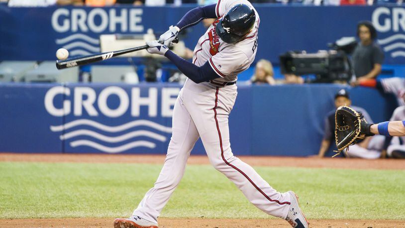 Freddie Freeman of the Braves hits an RBI double. (Photo by Mark Blinch/Getty Images)