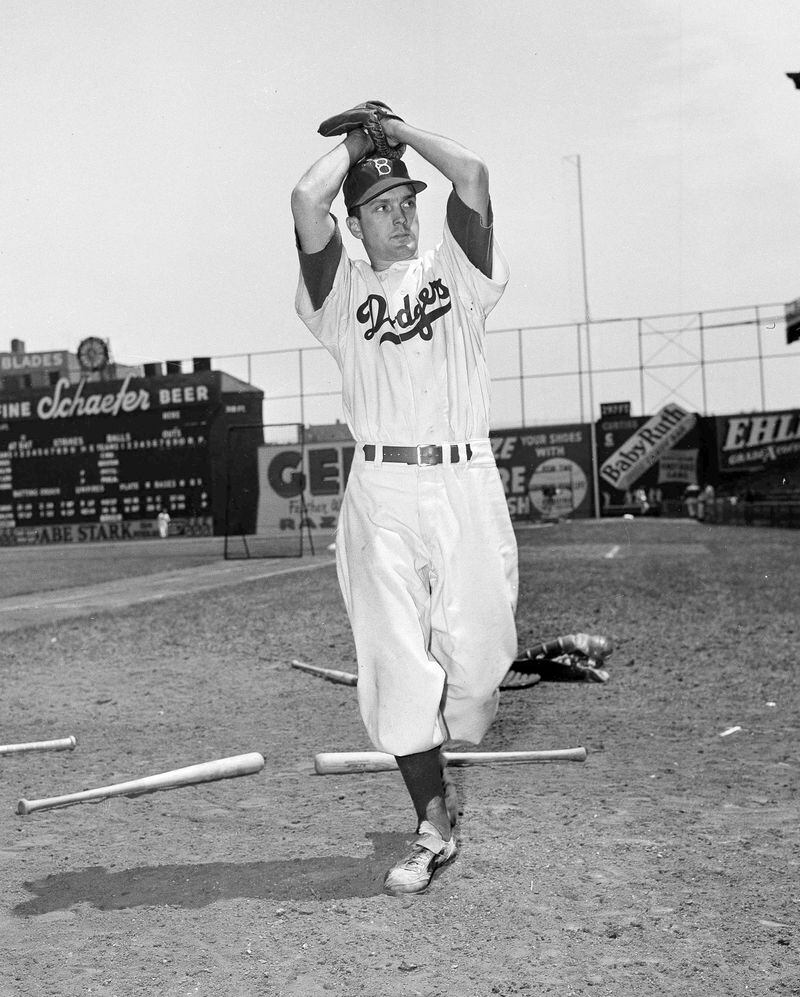 FILE - Brooklyn Dodgers pitcher Carl Erskine shows his form in New York, May 10, 1951. Carl Erskine, who pitched two no-hitters as a mainstay on the Brooklyn Dodgers and was a 20-game winner in 1953 when he struck out a then-record 14 in the World Series, died Tuesday, April 16, 2024, at Community Hospital Anderson in Anderson, Indiana, according to Michele Hockwalt, the hospital’s marketing and communication manager. He was 97. (AP Photo/John Rooney, File)