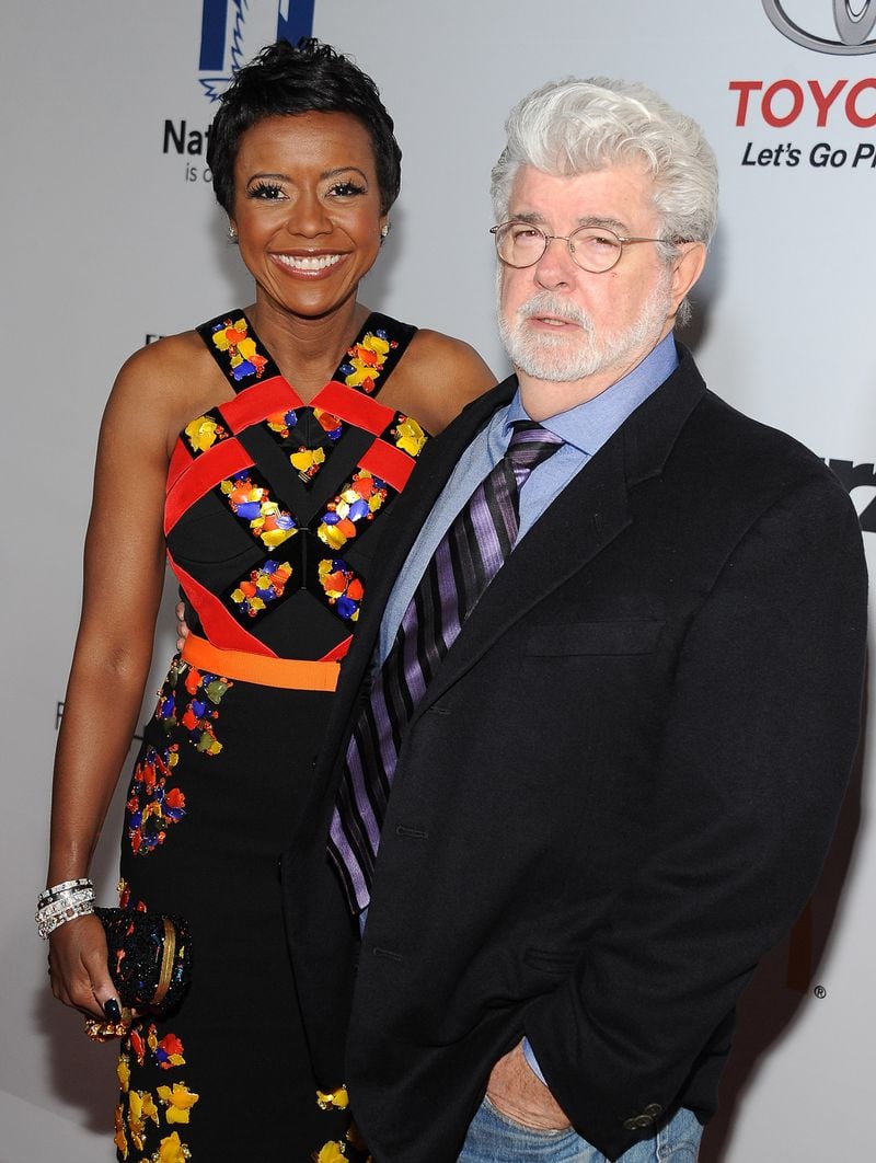 Director George Lucas (R) and wife Mellody Hobson attend the 2014 Ebony Power 100 List event at Avalon on November 19, 2014 in Hollywood, California. (Photo by Angela Weiss/Getty Images)