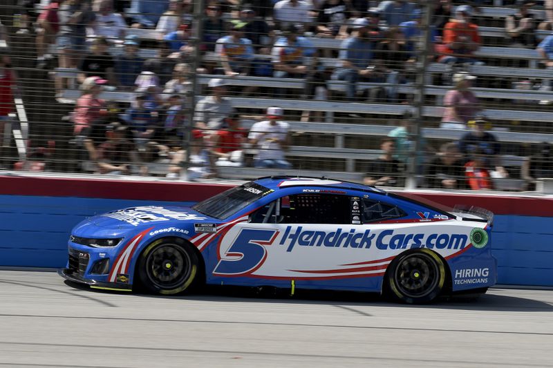 Kyle Larson (5) comes out of Turn 4 during a NASCAR Cup Series auto race at Texas Motor Speedway in Fort Worth, Texas, Sunday, April 14, 2024. (AP Photo/Randy Holt)
