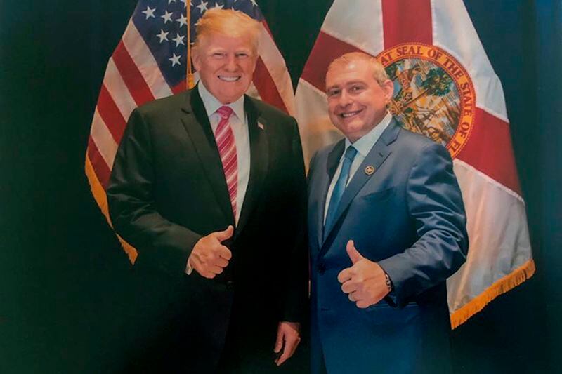 This undated image released by the House Judiciary Committee from documents provided by Lev Parnas to the committee in the impeachment probe against President Donald Trump, shows a photo of Lev Parnas with Trump in Florida.