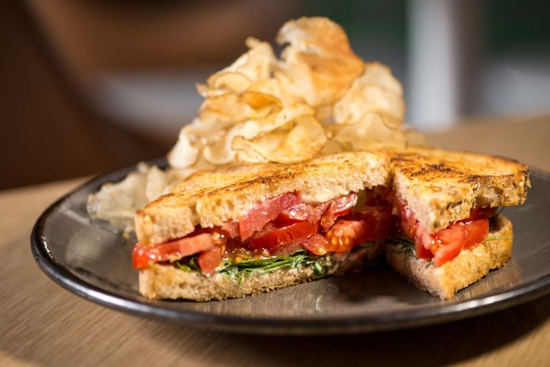The Molly B’s tomato sandwich has tomatoes, arugula and Duke’s mayonnaise, and comes with fennel-pollen dusted potato chips. CONTRIBUTED BY MIA YAKEL