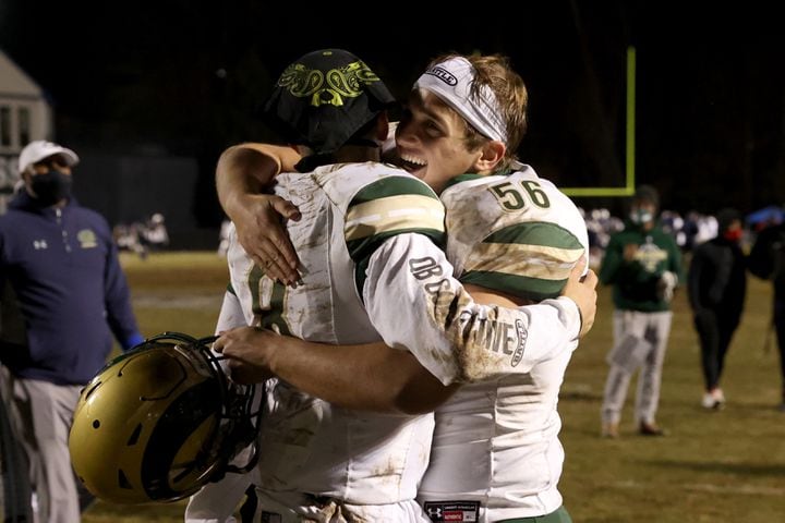 Dec. 18, 2020 - Norcross, Ga: Grayson quarterback Jake Garcia, left, celebrates with offensive lineman Walker Williams (56) after their 28-0 win against Norcross in the Class AAAAAAA semi-final game at Norcross high school Friday, December 18, 2020 in Norcross, Ga.. Grayson advances to play in the Class AAAAAAA final. JASON GETZ FOR THE ATLANTA JOURNAL-CONSTITUTION