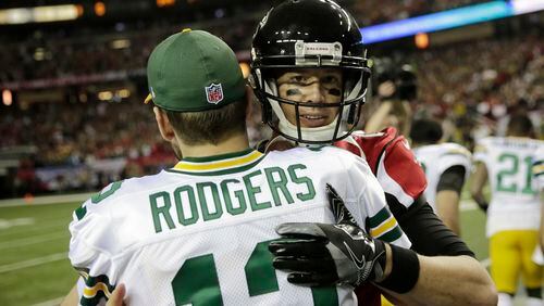 Green Bay Packers' Aaron Rodgers hugs Atlanta Falcons' Matt Ryan before the NFL football NFC championship game Sunday, Jan. 22, 2017, in Atlanta. (AP Photo/David Goldman)