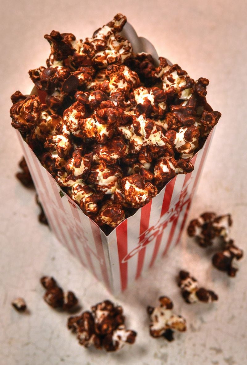 Should you have popcorn OR a chocolate snack with your movie? You can have both with Dark Chocolate Sea Salt Popcorn. (Styling by Susan Puckett / Chris Hunt for the AJC)