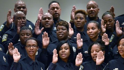 New Atlanta school district police force members are sworn in Thursday. HYOSUB SHIN / HSHIN@AJC.COM