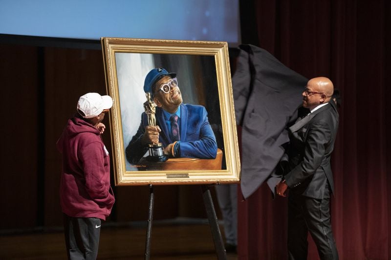 President David A. Thomas reveals Spike Lee’s portrait to him during Morehouse’s inaugural Human Rights Film Festival on Oct. 12, 2019. It will be installed in the Martin Luther King Jr. International Chapel. CONTRIBUTED BY SEAN MCNEIL