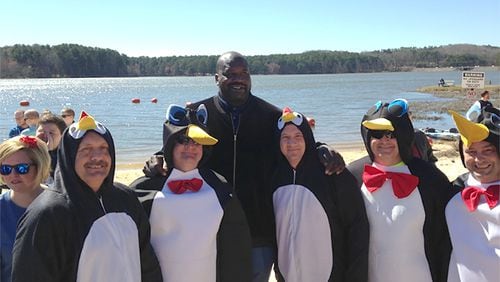 Shaquille O’Neal (the tall guy) poses with five Dalton police officers (the ones dressed as penguins) at Special Olympics Georgia's Polar Plunge event at Lake Acworth on Feb. 25, 2017.