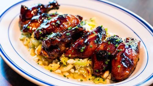 Though they’re listed on the menu as an appetizer, you could make a meal out of Coalition’s grilled chicken wings, which are served over a celery and blue cheese salad. CONTRIBUTED BY HENRI HOLLIS