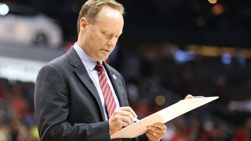 041916 ATLANTA: Hawks head coach Mike Budenholzer draws up a play during a time out against the Celtics in their NBA Eastern Conference first round playoff game at Philips Arena on Tuesday, April 19, 2016. Curtis Compton / ccompton@ajc.com