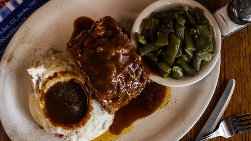 The full meatloaf with mashed potatoes and green beans from Blue Ribbon Grill.