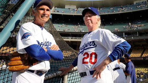 Former Dodger pitchers Sandy Koufax, left, and Don Sutton chat before an old-timers game at Dodger Stadium Saturday, June 8, 2013 in Los Angeles, California. (Wally Skalij/Los Angeles Times/TNS)