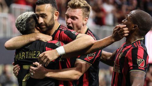 Atlanta United players celebrate after forward Justin Meram  scored a goal during the first half in a MLS game against the New York City Red Bulls on Sunday, July 7, 2019, in Atlanta. Branden Camp/SPECIAL