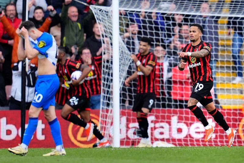 Bournemouth's Justin Kluivert, right, celebrates after scoring his side's third goal during the English Premier League soccer match between AFC Bournemouth and Brighton & Hove Albion in Bournemouth, England, Sunday, April 28, 2024. (Adam Davy/PA via AP)
