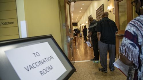 In this file photo, people wait to get their second COVID-19 vaccination shot during a DeKalb County Board of Health and Delta Sigma Theta Sorority, Inc. COVID-19 vaccination event at the Lou Walker Senior Center in Stonecrest. (Alyssa Pointer / Alyssa.Pointer@ajc.com)
