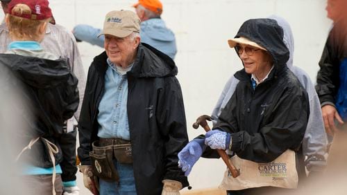 Former president Jimmy Carter and his wife, Rosalynn Carter, join city and state officials, Habitat for Humanity leaders and volunteers at a project in Washington on Oct. 4, 2010. MUST CREDIT: Marvin Joseph/The Washington Post