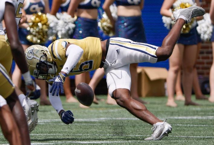 Defensive back K.J. Wallace (16)  tries to control a pass during Georgia Tech's spring football game in Atlanta on Saturday, April 15, 2023.   (Bob Andres for the Atlanta Journal Constitution)