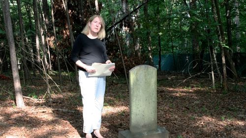 Joan Compton, president of the Johns Creek Historical Society, at the Macedonia African Methodist Church Cemetery in Johns Creek. DAVID IBATA FOR THE AJC