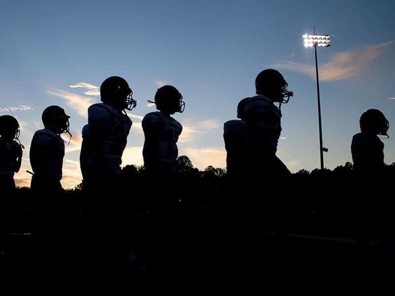 football players walking silhouette