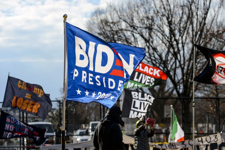 A flag flies in support of President-elect Joe Biden at Black Lives Matter Plaza in Washington on Inauguration Day, Wednesday, Jan. 20, 2021. (Kenny Holston/The New York Times)