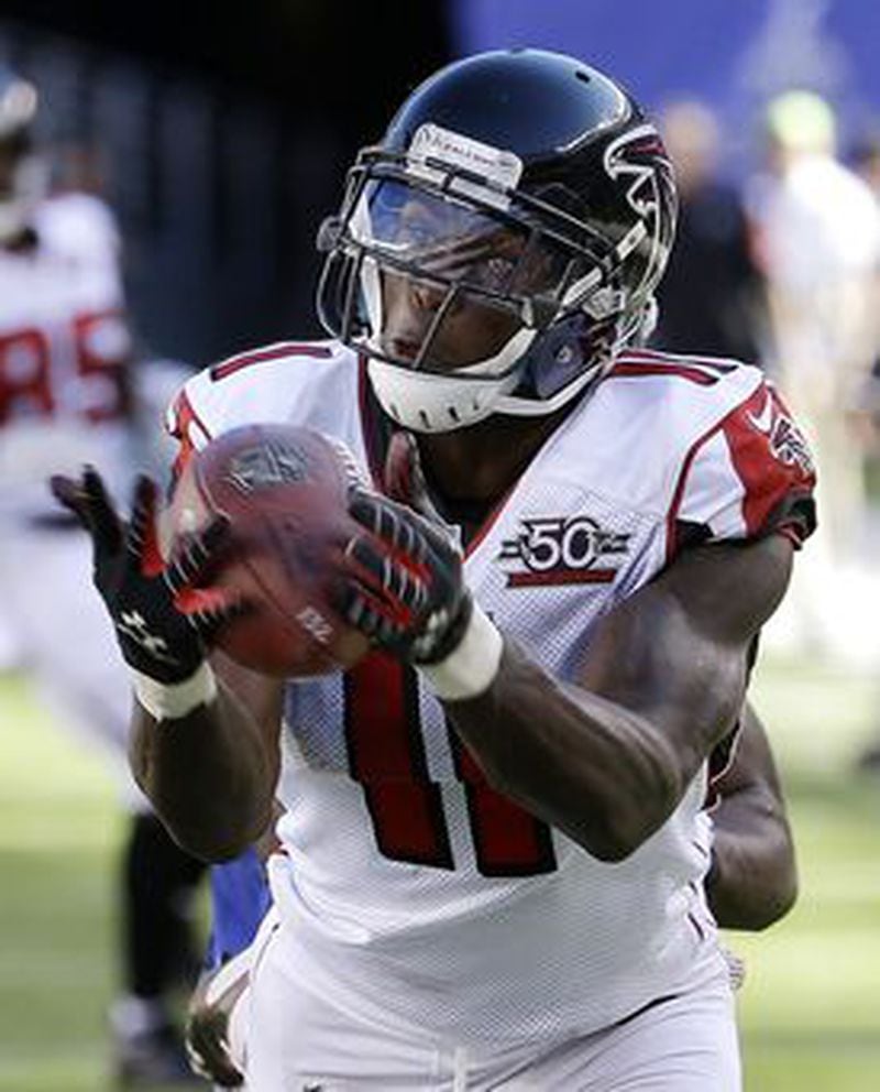 Falcons wide receiver Julio Jones makes a catch near the end zone on a pass from quarterback Matt Ryan as Giants cornerback Prince Amukamara defends during the second half of an NFL football game, Sunday, Sept. 20, 2015, in East Rutherford, N.J. (AP Photo/Seth Wenig)