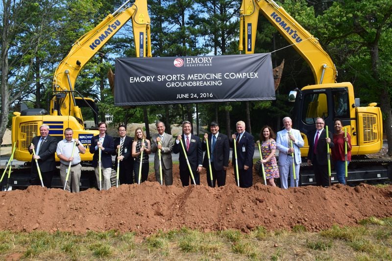 Brookhaven city officials including Mayor John Ernst, center, celebrate the June 24, 2016, groundbreaking of the Emory Sports Medicine Complex. (Photo Handout)