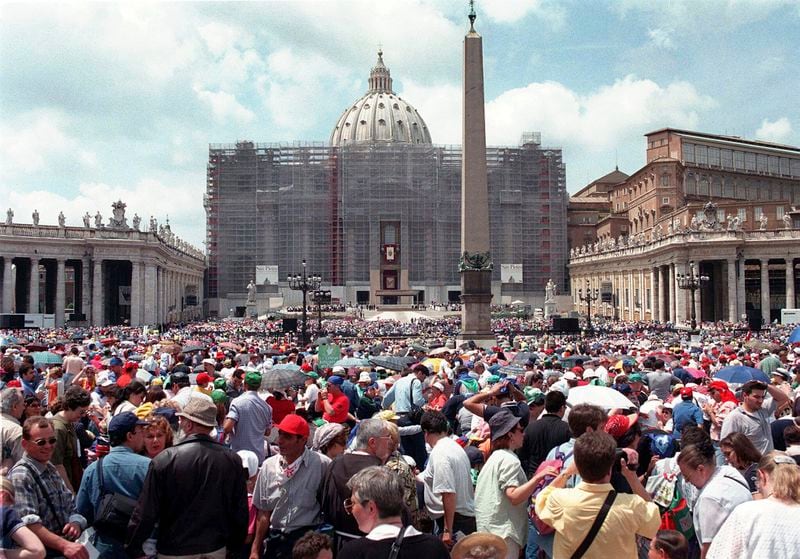 Pilgrims crowd St. Peter's Square at the Vatican, Saturday, May 30, 1998, on Pentecost Day. The Vatican crosses a key milestone Thursday, May 9, 2024, in the run-up to its 2025 Jubilee with the promulgation of the official decree establishing the Holy Year: a once-every-quarter-century event that is expected to bring some 32 million pilgrims to Rome and has already brought months of headaches to Romans. (AP Photo/Andrew Medichini)