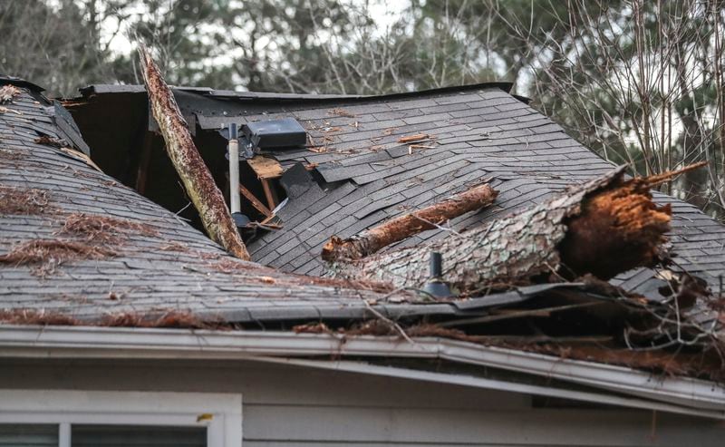 January 28, 2021 DeKalb County: A 1-year-old girl was rescued from a DeKalb County home Thursday morning, Jan. 28, 2021 after a tree fell on her bedroom, breaking through the ceiling just feet above her crib. (John Spink / John.Spink@ajc.com)