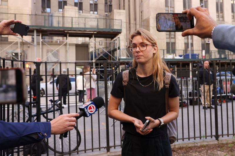 Kara McGee speaks to members of the media outside Manhattan criminal court, Tuesday, April 16, 2024, in New York. McGee, who works in cybersecurity, said she made eye contact with Trump after she told the judge that it would be hard for her to be a juror due to her work schedule. (AP Photo/Yuki Iwamura)