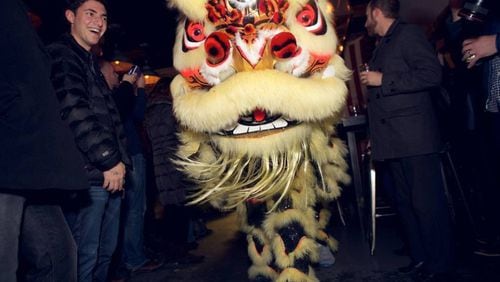 Traditional lion dancers will parade throughout Sweet Auburn BBQ on Feb. 2. HANDOUT / Blue Hominy Public Relations.