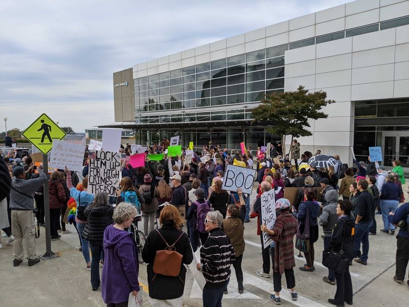 A few hundred protesters gathered at the Georgia World Congress Center as President Donald Trump was set to arrive for a campaign event on Nov. 8, 2019 in Atlanta.