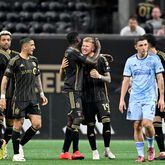 Los Angeles FC midfielder Mateusz Bogusz (19) celebrates with teammates after scoring during the second half in a MLS soccer match at Mercedes-Benz Stadium, Saturday, May 25, 2024, in Atlanta. Los Angeles FC won 1-0 over Atlanta United. (Hyosub Shin / AJC)