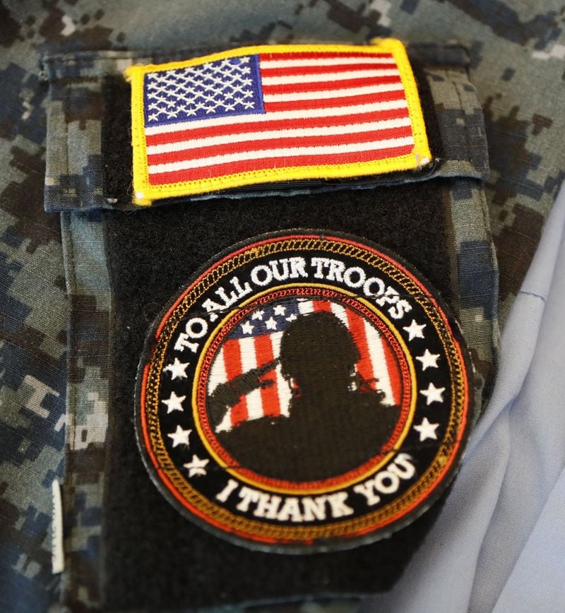David Gallemore’s Veterans Home & Business Services Atlanta handed out shirts bearing this patch to employees. The company won a contract with Fulton County’s jobs program claiming that it planned to hire military veterans across the U.S. BOB ANDRES / BANDRES@AJC.COM