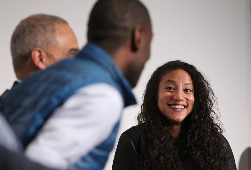 Harvard professor Elizabeth Hinton laughs at a joke made by DeRay McKesson during a panel on race at the Carter Library on Wednesday. (Henry Taylor / henry.taylor@ajc.com)