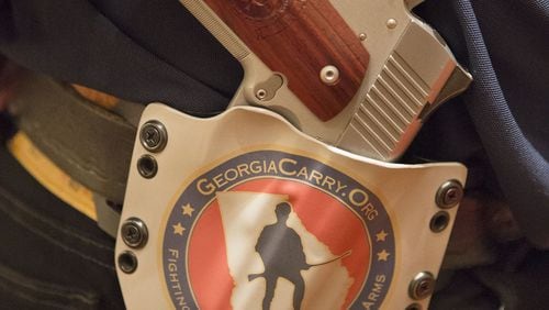 8/16/14-ATLANTA: Bruce Greenfield carried his gun in a custom holster during the 6th Annual GeorgiaCarry.org convention at the Renaissance Atlanta Waverly Hotel in Atlanta on Saturday August 16th, 2014. Second Amendment supporters celebrated Georgian's right to bear arms which has been expanded after the passage of HB60, a bill that gained international attention. (Photo by Phil Skinner / For the AJC) Gun owners lost an appeal to the Georgia Supreme Court today regarding guns in school zones. (AJC Photo)