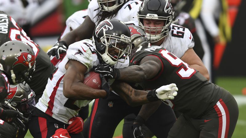 Atlanta Falcons running back Brian Hill (23) rushes against the Tampa Bay Buccaneers during the second half Sunday, Jan. 3, 2021, in Tampa, Fla. (Jason Behnken/AP)