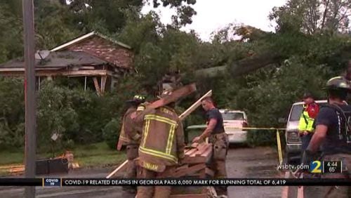 A man’s body was discovered Wednesday afternoon after a large tree split in half and fell on a home in southwest Atlanta.