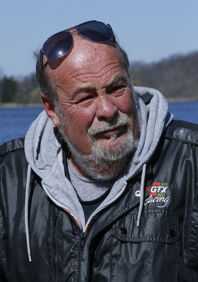 Don Thorn talks about painting rocks before placing some around Springfield Lake on April 20, 2018, in Springfield Township, Ohio. (Karen Schiely/Akron Beacon Journal/TNS)