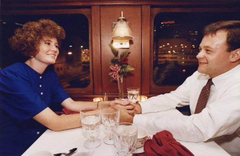 New Georgia Railroad passengers Meg Nealon and Greg McCullers enjoy a 1990 ride on the dining excursion train. AJC PHOTO ARCHIVES