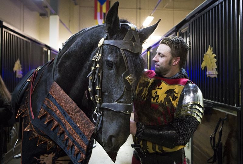 11-9-18 - Lawrenceville, GA - Jason Jones, 40, head knight, stands beside Toffee, a performing horse, in the stable area during a media tour of Medieval Times Dinner & Tournament at Sugarloaf Mills in Lawrenceville, Ga., on Friday, Nov. 9, 2018. For the first time in its nearly 35 year history, the show is introducing a queen into its performance. (Casey Sykes for The Atlanta Journal-Constitution)