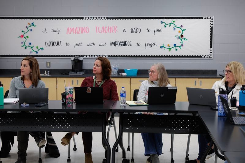 Faculty at Findley Oaks Elementary School in Fulton County take a training course for Centegix crisis alert badges on Monday, March 20, 2023.  (Natrice Miller/ natrice.miller@ajc.com)