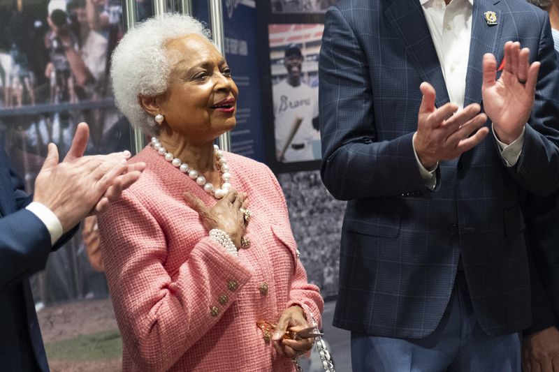 Billye Aaron takes in the applause after cutting cutting the ribbon to open the Atlanta History Center exhibit ÒMore Than Brave: The Life of Henry AaronÓ on Monday, April 8, 2024.ÊÊÊ(Ben Gray / Ben@BenGray.com)