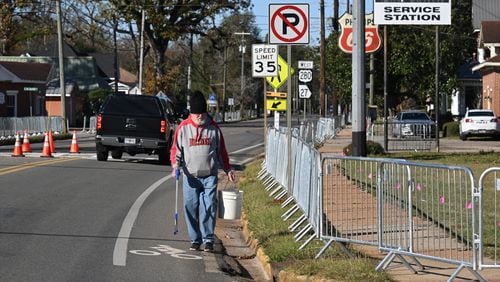 George McAfee of Plains picks up trashes around downtown Plains ahead of Wednesday’s first lady Rosalynn Carter funeral events, Tuesday, November 28, 2023, in Plains. (Hyosub Shin / Hyosub.Shin@ajc.com)