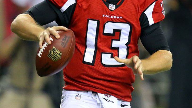 Falcons quarterback T.J. Yates looks to pass against the Titans during the second half in their NFL exhibition game on Sunday, August 23, 2014, in Atlanta.