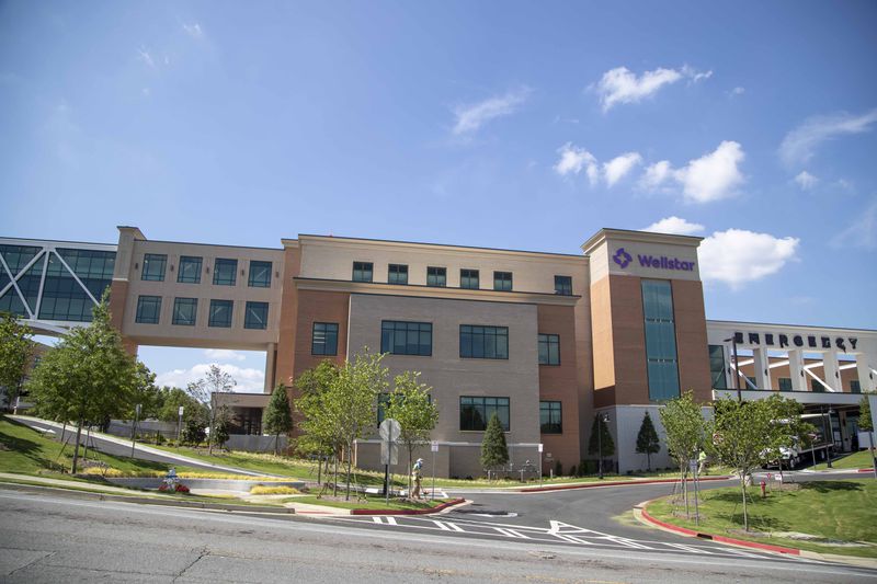In documents filed with financial agencies weeks before AMC South was announced to close, the Wellstar Health System argued for a $200 million loan to build a seven-story tower at the Wellstar Kennestone Hospital in Cobb County's most affluent suburb.  (Alyssa Pointer/AJC File)
