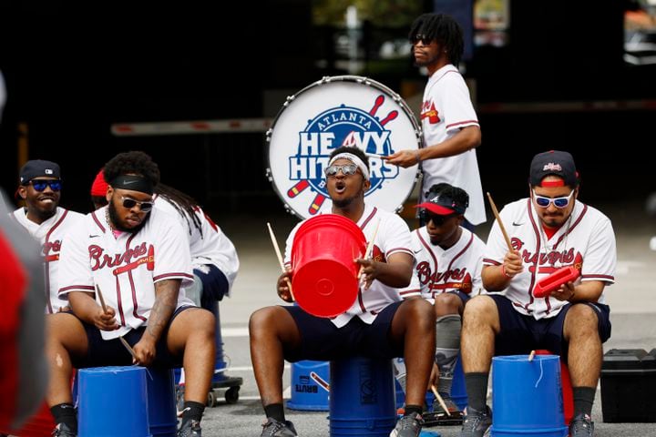 Members of the Heavy Hitters drummers perform by Battery Avenue to entertain the fans outside Truist Park on Tuesday, October 11, 2022. Miguel Martinez / miguel.martinezjimenez@ajc.com