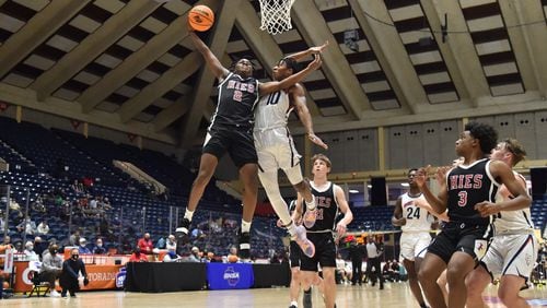 March 10, 2021 Macon - Holy Innocents' Garrison Powell (2) goes up for a shot against Mt. Pisgah's Jojo Peterson (10) during the 2021 GHSA State Basketball Class A Private Championship game at the Macon Centreplex in Macon on Wednesday, March 10, 2021. Mt. Pisgah won 43-41 over Holy Innocents. (Hyosub Shin / Hyosub.Shin@ajc.com)