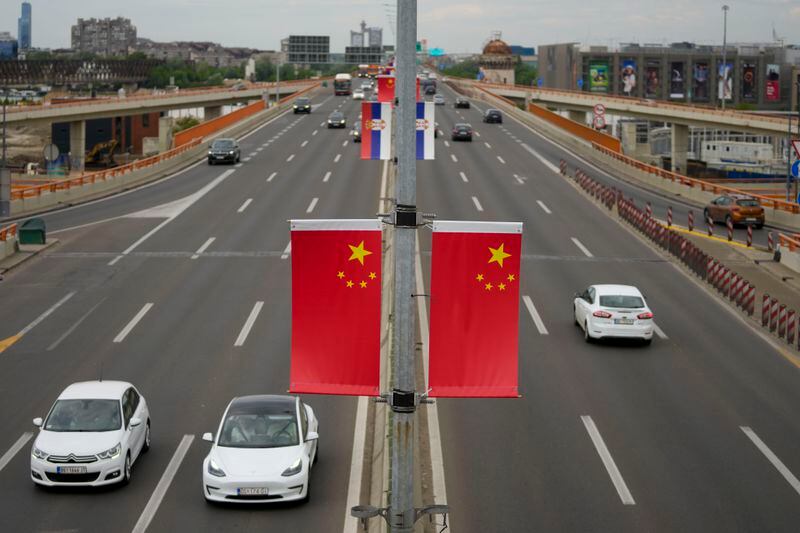Chinese and Serbian flags fly on lampposts, days before the visit of Chinese President Xi Jinping in Belgrade, Serbia, Wednesday, May 1, 2024. Xi will visit France, Serbia and Hungary next week as Beijing appears to seek a larger role in the conflict between Russia and Ukraine that has upended global political and economic security. (AP Photo/Darko Vojinovic)