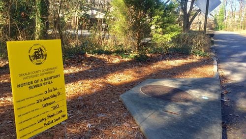 A sign notes a recent sewer spill in DeKalb County.